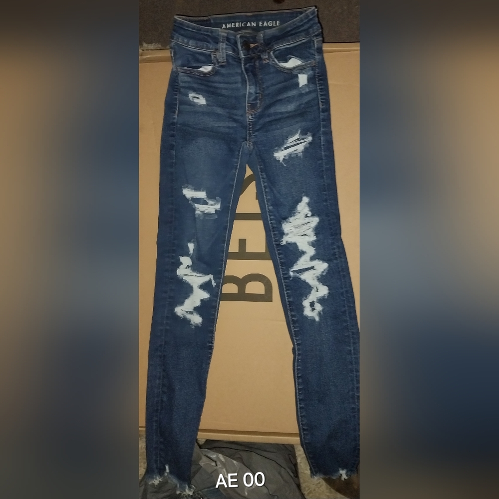 American Eagle high rise distressed raw hem denim jegging stretch size 00